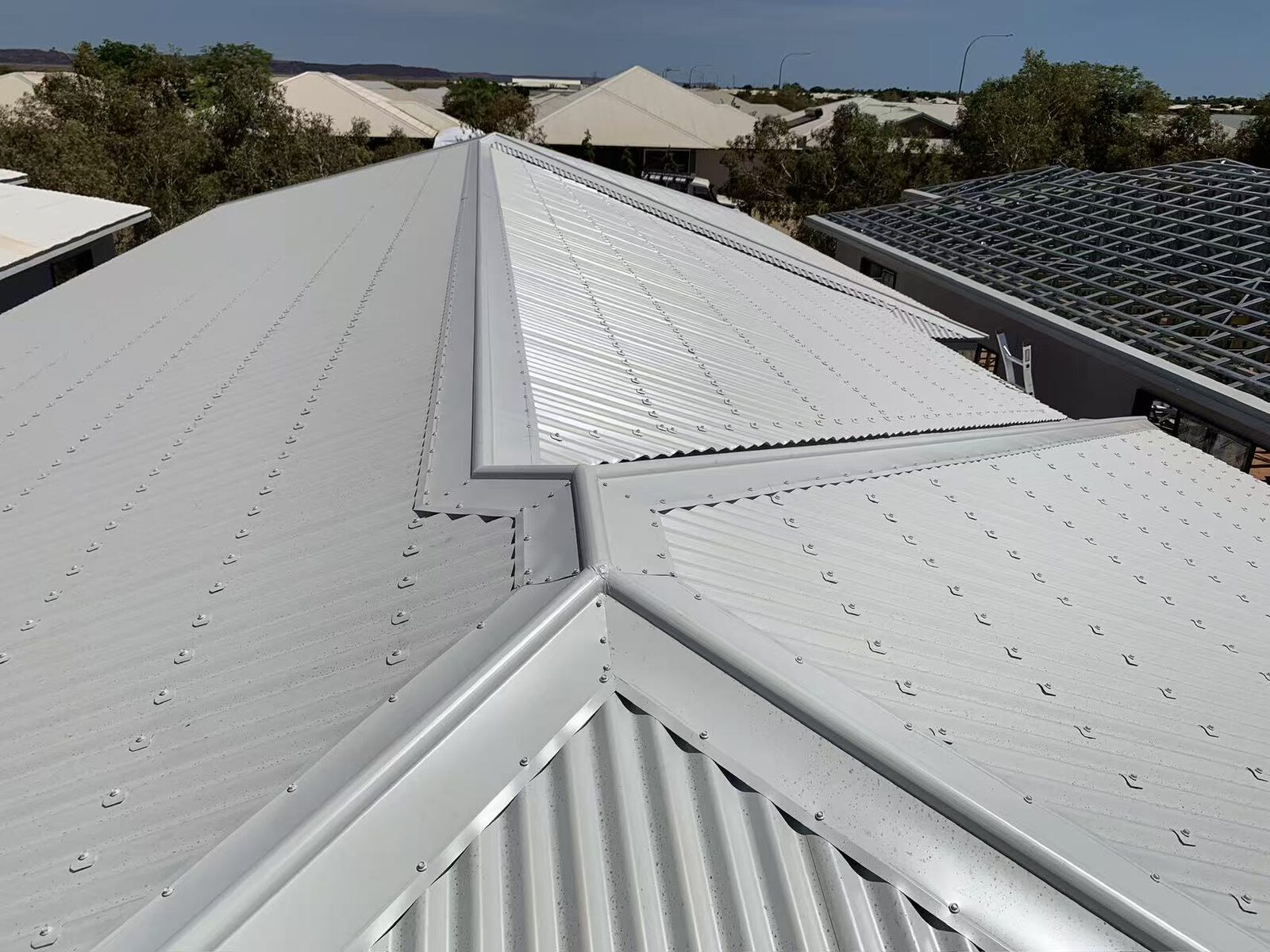 Close-up of Colorbond ridge and hip capping detail